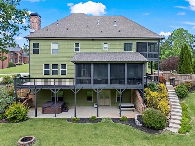 rear view of property with a sunroom, stairway, a patio, and a chimney
