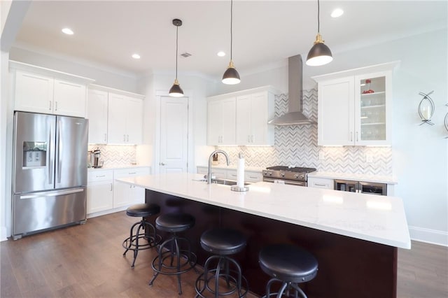 50 Quiet Cove Way, Monticello, GA 31064 - kitchen featuring stainless steel appliances, wall chimney exhaust hood, a sink, tasteful backsplash, and white cabinets