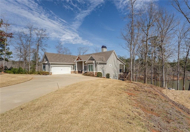 50 Quiet Cove Way, Monticello, GA 31064 - view of front of house with driveway, a garage, and a chimney