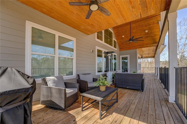 50 Quiet Cove Way, Monticello, GA 31064 - wooden deck with ceiling fan and outdoor lounge area