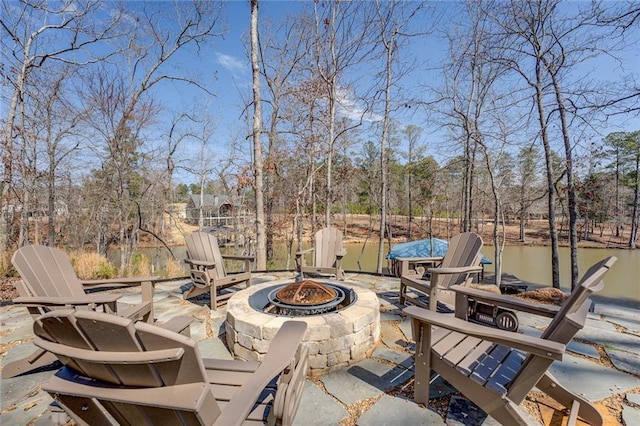 50 Quiet Cove Way, Monticello, GA 31064 - view of patio featuring an outdoor fire pit, view of scattered trees, and a water view