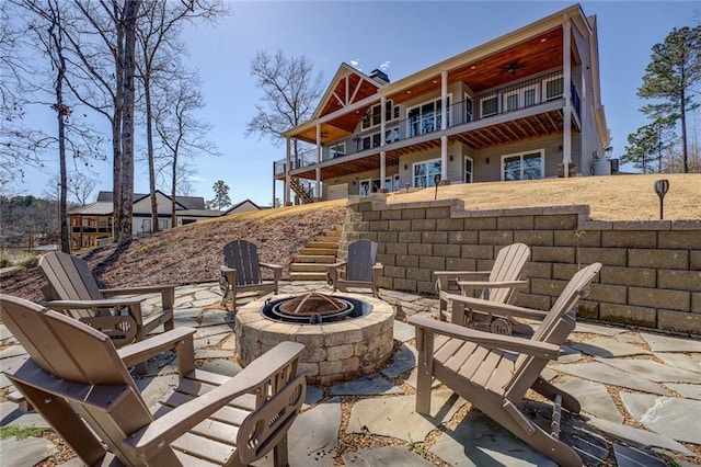 50 Quiet Cove Way, Monticello, GA 31064 - view of patio with an outdoor fire pit, stairway, a balcony, and ceiling fan