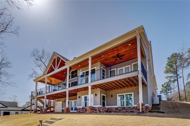 50 Quiet Cove Way, Monticello, GA 31064 - rear view of house featuring ceiling fan, a balcony, and french doors
