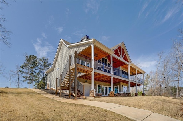50 Quiet Cove Way, Monticello, GA 31064 - view of front of house with ceiling fan, a front yard, and stairway