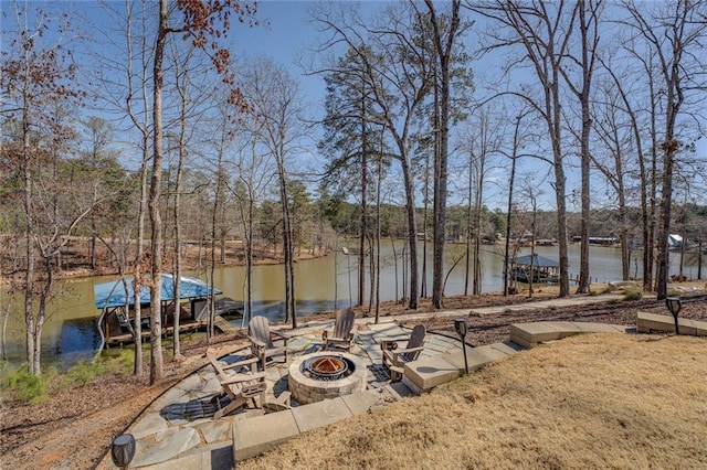 50 Quiet Cove Way, Monticello, GA 31064 - view of yard featuring an outdoor fire pit, a water view, and a boat dock