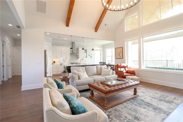 50 Quiet Cove Way, Monticello, GA 31064 - living room with baseboards, a chandelier, dark wood-type flooring, high vaulted ceiling, and beam ceiling
