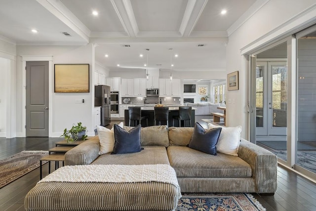 living room with beam ceiling, ornamental molding, and dark wood-type flooring