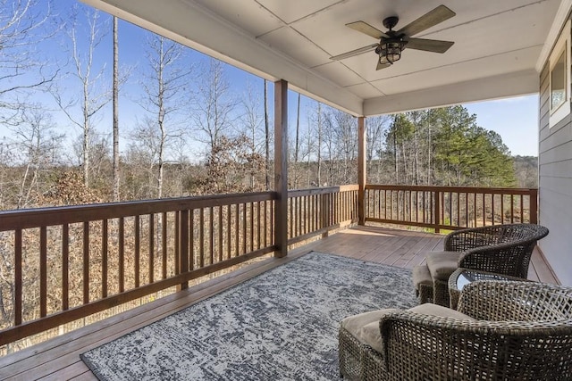 wooden terrace featuring ceiling fan