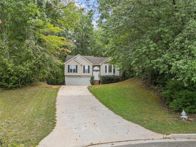 view of front of home with a garage and a front lawn