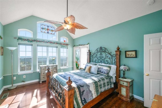 bedroom with dark wood-type flooring, ceiling fan, and vaulted ceiling