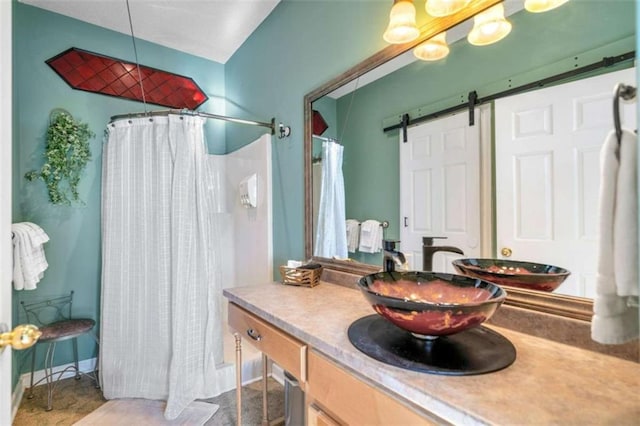 bathroom with vanity and curtained shower