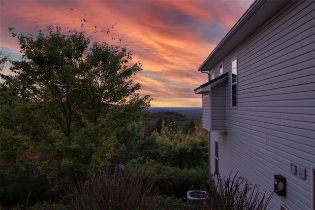 view of property exterior at dusk