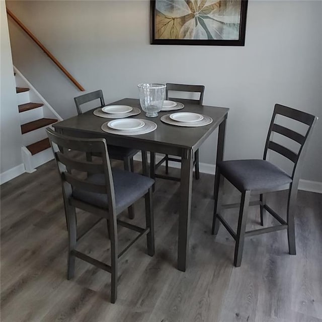 dining space featuring dark hardwood / wood-style flooring