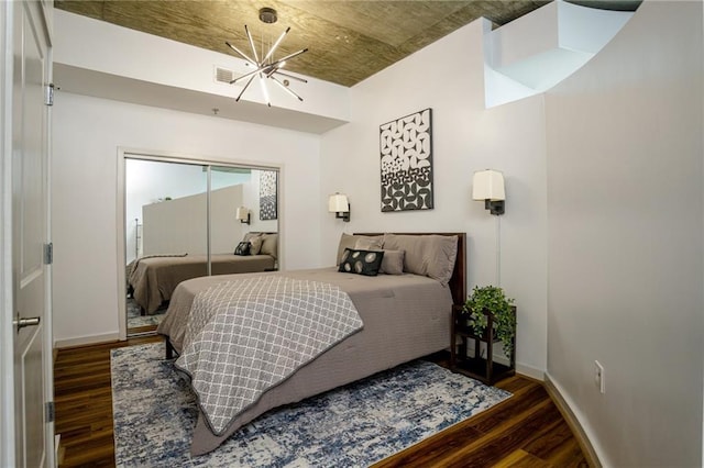 bedroom featuring dark hardwood / wood-style flooring and a closet