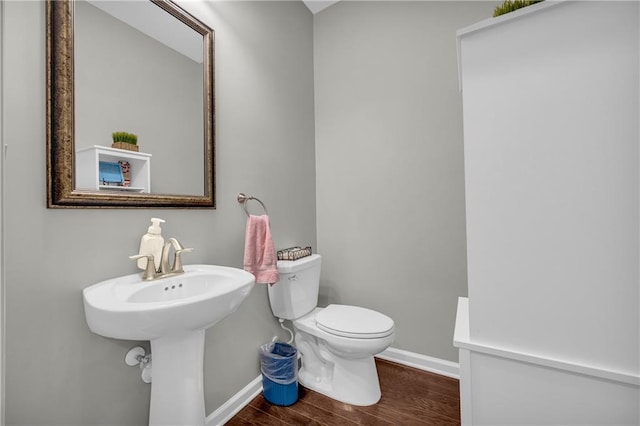 2735 Kimblewick Ct, Cumming, GA 30040 - bathroom with toilet, baseboards, and wood finished floors