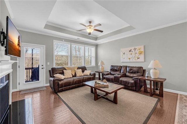 2735 Kimblewick Ct, Cumming, GA 30040 - living room featuring a raised ceiling, a fireplace with flush hearth, ceiling fan, baseboards, and hardwood / wood-style flooring