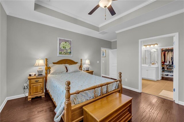 2735 Kimblewick Ct, Cumming, GA 30040 - bedroom featuring baseboards, dark wood finished floors, ensuite bath, ornamental molding, and a tray ceiling
