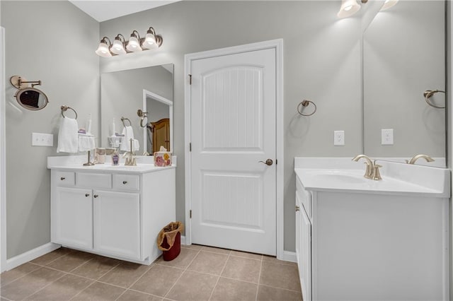 2735 Kimblewick Ct, Cumming, GA 30040 - full bath with two vanities, tile patterned flooring, and a sink