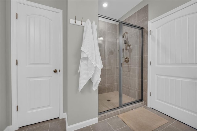 2735 Kimblewick Ct, Cumming, GA 30040 - bathroom featuring tile patterned flooring, a shower stall, and baseboards