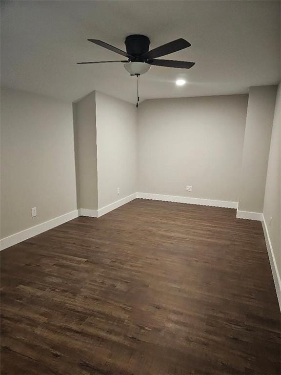 2735 Kimblewick Ct, Cumming, GA 30040 - spare room with dark wood-style flooring, a ceiling fan, and baseboards