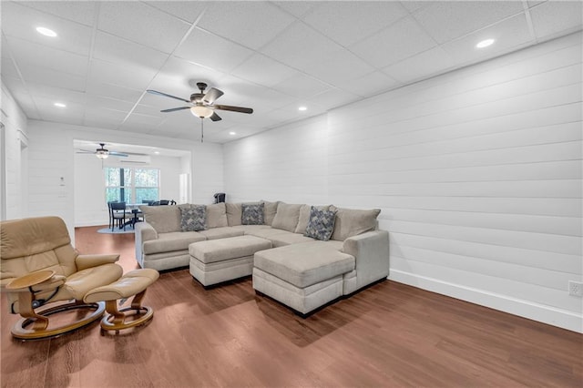2735 Kimblewick Ct, Cumming, GA 30040 - living area with baseboards, dark wood finished floors, a wall mounted air conditioner, a paneled ceiling, and recessed lighting