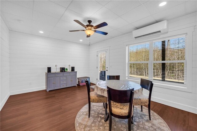 2735 Kimblewick Ct, Cumming, GA 30040 - dining space with a wall unit AC, a paneled ceiling, baseboards, and dark wood-type flooring