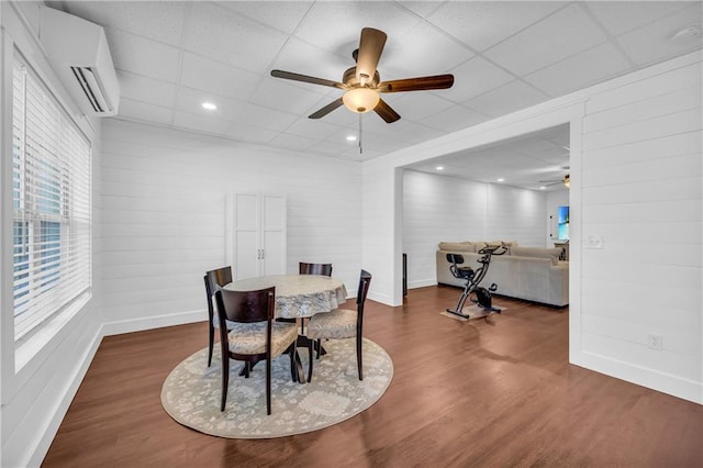 2735 Kimblewick Ct, Cumming, GA 30040 - dining space featuring ceiling fan, baseboards, an AC wall unit, and wood finished floors