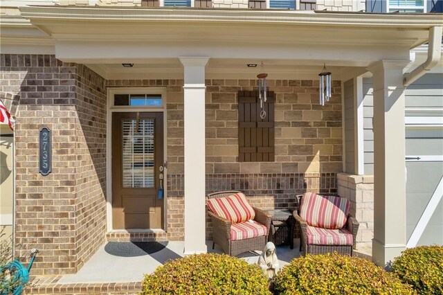 2735 Kimblewick Ct, Cumming, GA 30040 - view of exterior entry with brick siding and a porch
