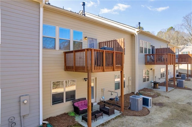 2735 Kimblewick Ct, Cumming, GA 30040 - rear view of house with a patio area, cooling unit, and a balcony