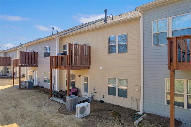 2735 Kimblewick Ct, Cumming, GA 30040 - rear view of property with a balcony, ac unit, and central AC