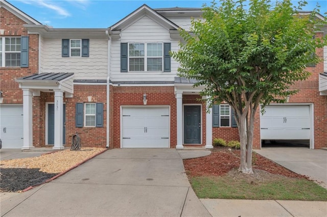 3829 Thayer Trce, Duluth, GA 30096 - townhome / multi-family property with concrete driveway, brick siding, and a garage