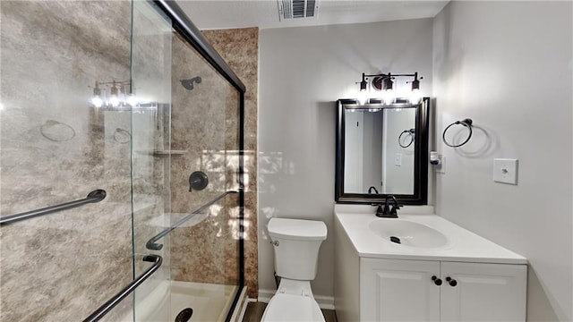 bathroom with vanity, toilet, and walk in shower