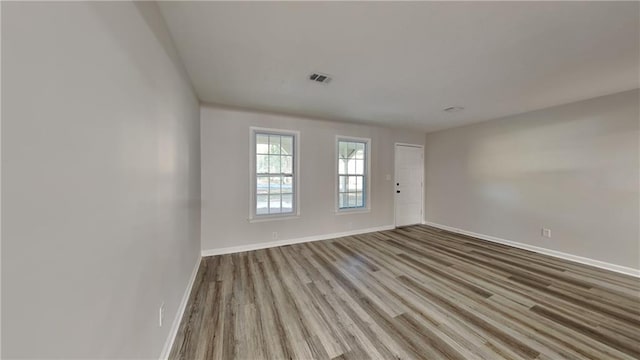 empty room with light wood-type flooring