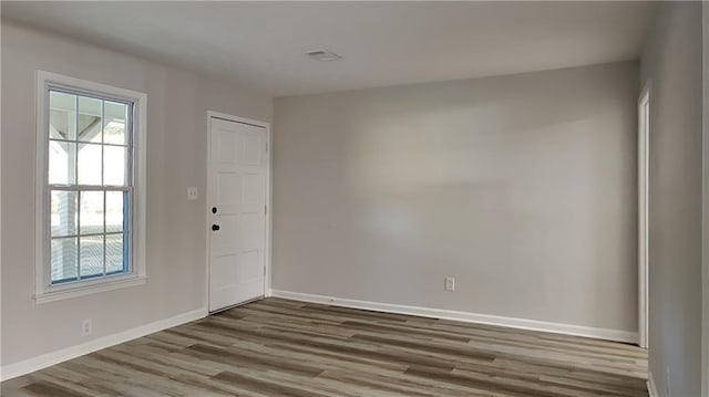 empty room featuring wood-type flooring