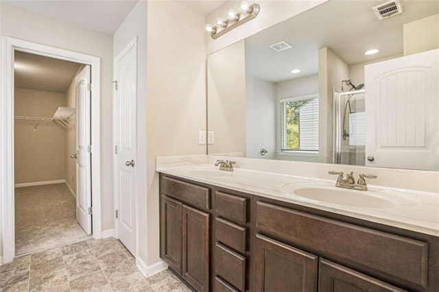 bathroom with vanity and an enclosed shower