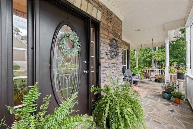 entrance to property featuring a porch