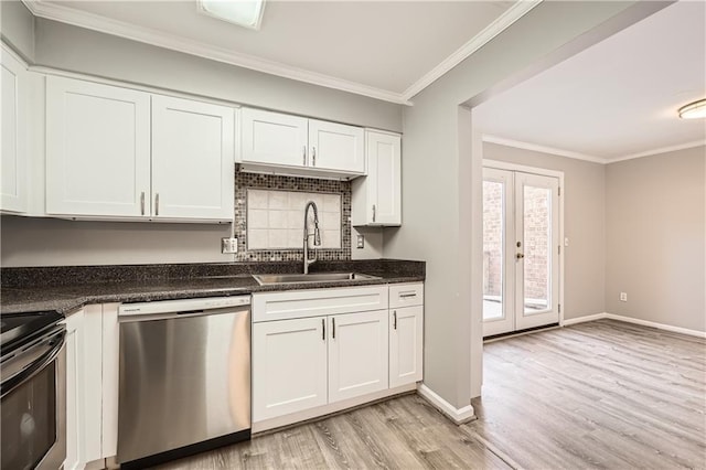 kitchen featuring crown molding, appliances with stainless steel finishes, light wood-style floors, white cabinetry, and a sink