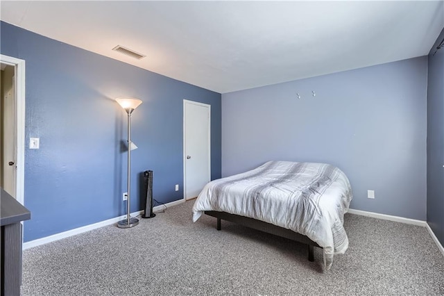 bedroom featuring baseboards, visible vents, and carpet flooring