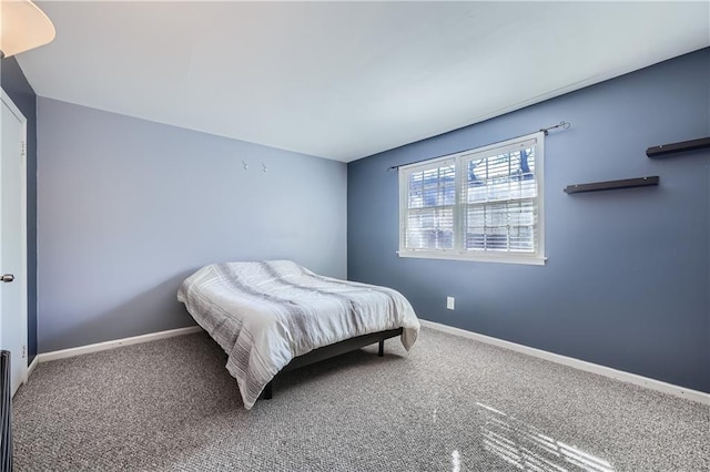 bedroom featuring carpet floors and baseboards