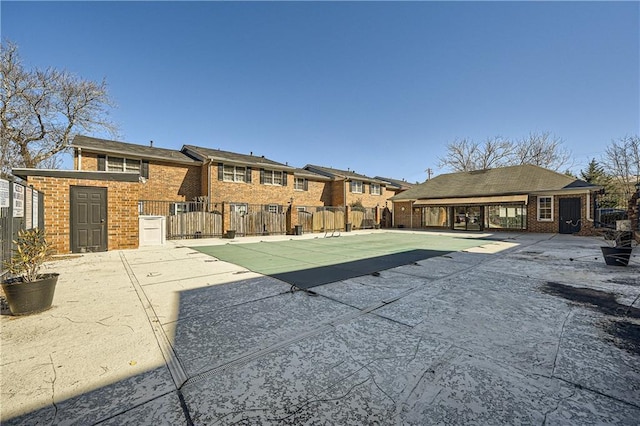 view of pool with fence and a patio