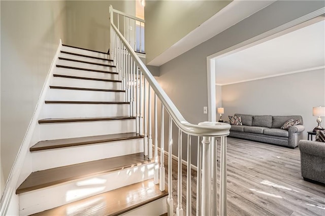 stairway with wood finished floors