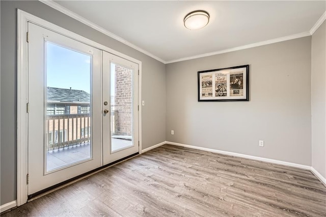 doorway featuring light wood-type flooring, french doors, crown molding, and baseboards