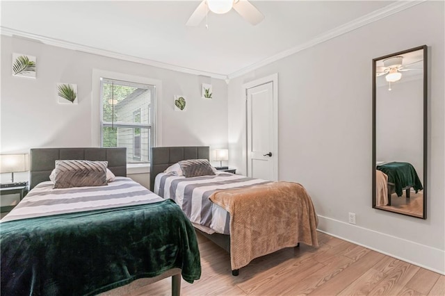 bedroom featuring crown molding, ceiling fan, and light wood-type flooring