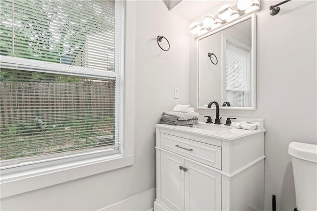 bathroom with vanity and toilet