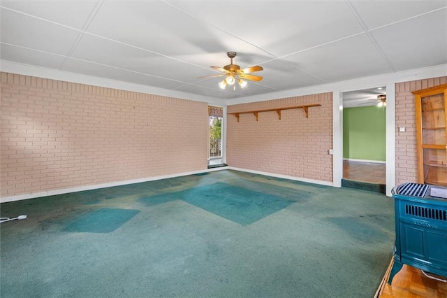 6674 Cowan Mill Rd, Winston, GA 30187 - carpeted spare room with brick wall and ceiling fan