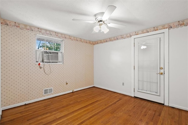 6674 Cowan Mill Rd, Winston, GA 30187 - unfurnished room with wood finished floors, cooling unit, and a ceiling fan