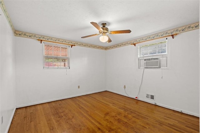 6674 Cowan Mill Rd, Winston, GA 30187 - unfurnished room featuring cooling unit, wood finished floors, and ceiling fan