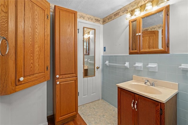 6674 Cowan Mill Rd, Winston, GA 30187 - bathroom with vanity, tile walls, and wainscoting