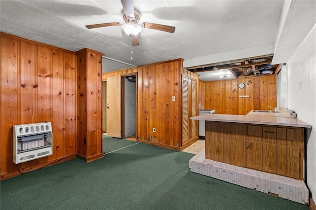 6674 Cowan Mill Rd, Winston, GA 30187 - kitchen with heating unit, carpet flooring, wooden walls, and ceiling fan