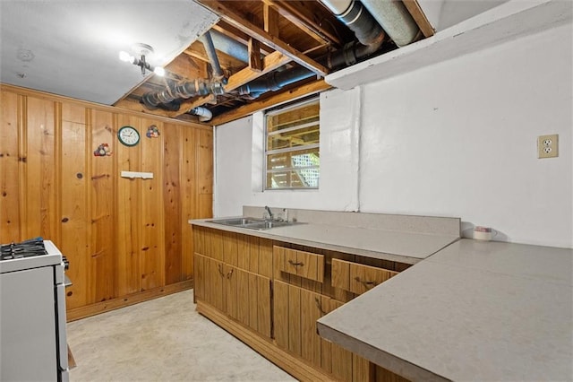 6674 Cowan Mill Rd, Winston, GA 30187 - kitchen with white range, wooden walls, and light countertops